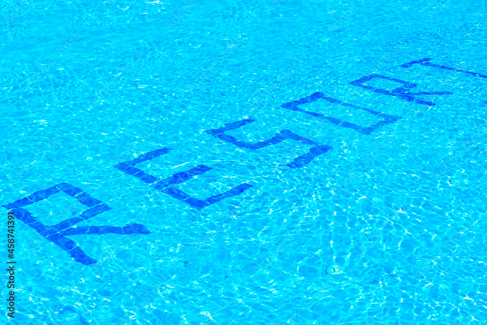 the inscription resort on the bottom of the pool with clear blue water