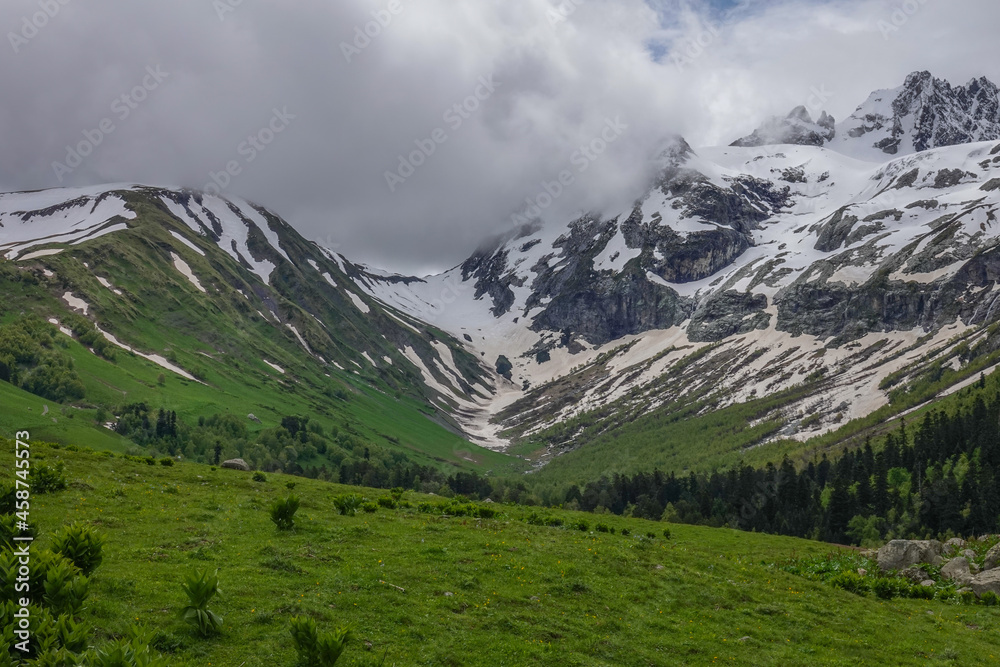 Mountain Ridge of Caucasian Range Partly Covered with Snow