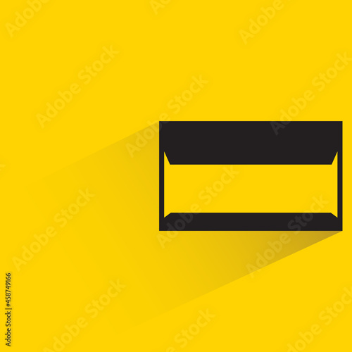 mail with shadow on yellow background