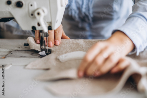 Woman tailor working at the sewing factory