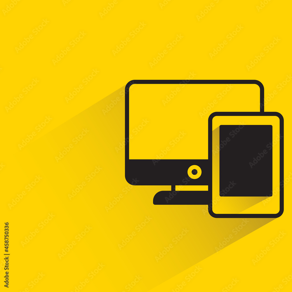 computer and smartphone with shadow on yellow background computer and smartphone with shadow on yellow background