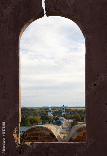 view of the city through the window of the old tower
