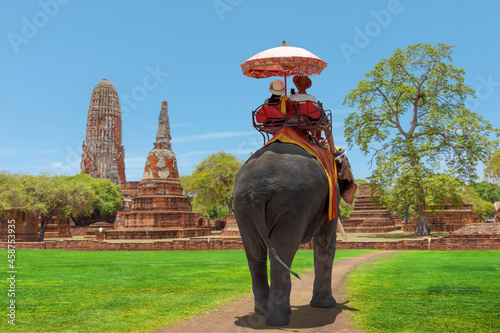 Tourists lover on an ride elephant tour of the ancient city ayutthaya, thailand