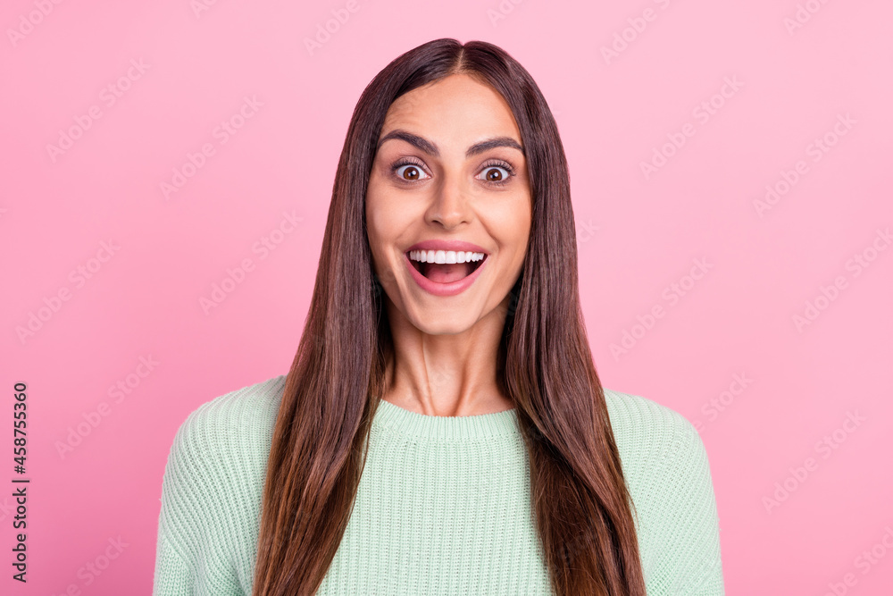 Photo of young cheerful woman happy positive smile amazed omg news sale isolated over pink color background Photo of young cheerful woman happy positive smile amazed omg news sale isolated over pink color background