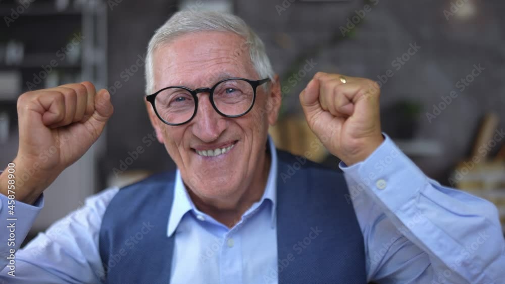 Portrait closeup of an excited self-confident attractive businessman with black eyeglasses rejoices and celebrates a victory or success. Portrait closeup of an excited self-confident attractive businessman with black eyeglasses rejoices and celebrates a victory or success.