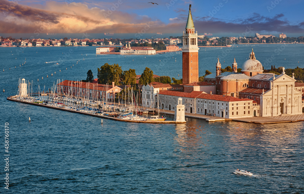 Fototapeta premium Panoramic view at island and Basilica di San Giorgio Maggiore. Venice Italy. Sunset over old town and Adriatic Sea.