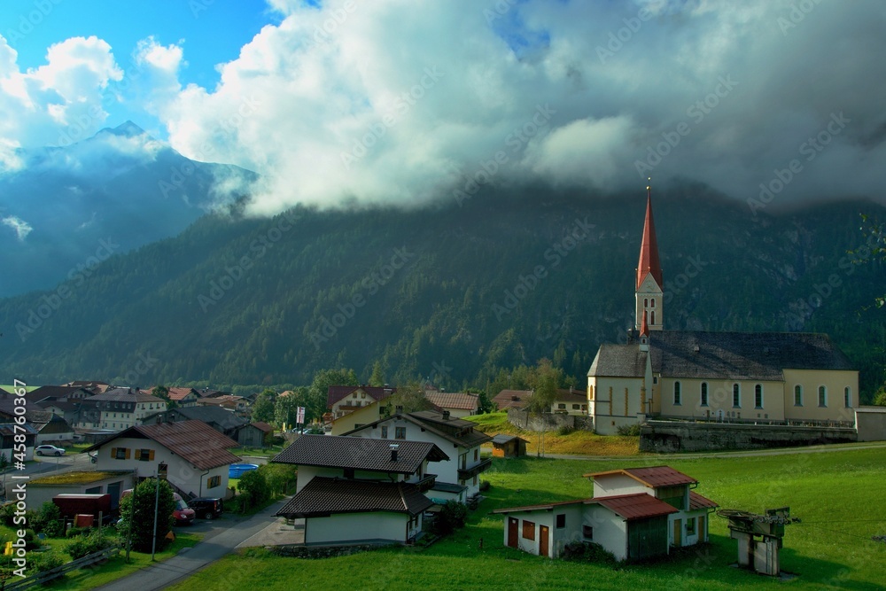 Austrian Alps - view of the church and its surroundings in the town of Holzgau in the Lechtal Alps