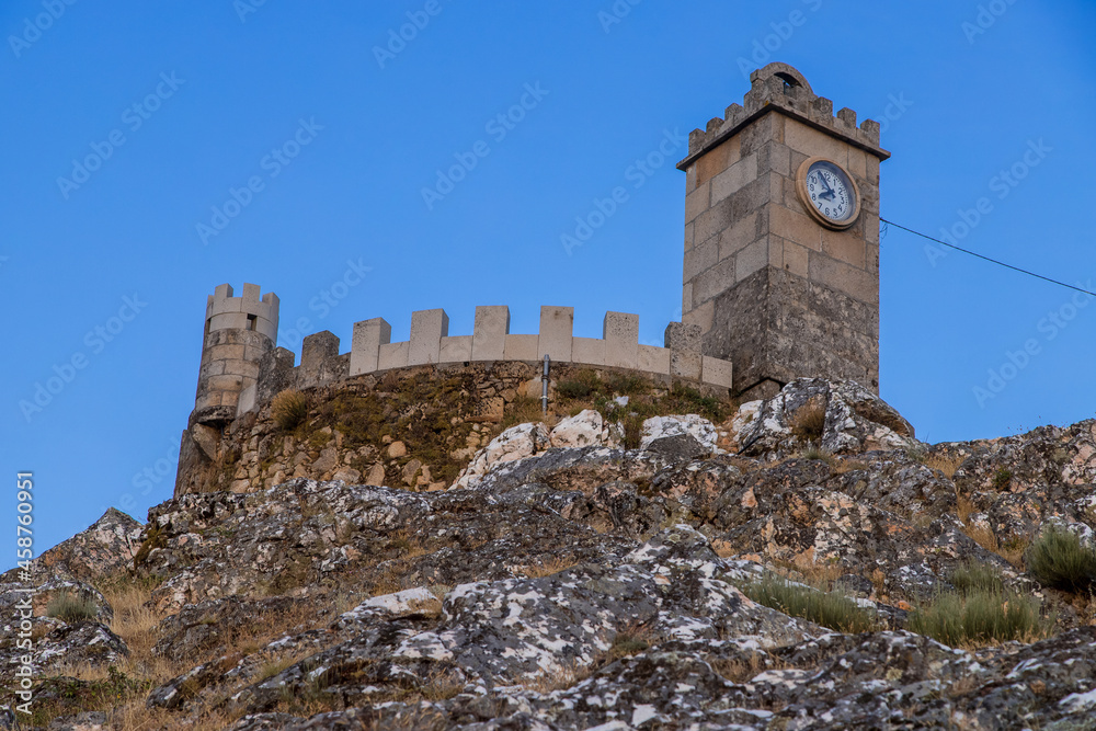 The tower of the castle. Exterior view of the castle in Folgosinho, Portuguese tourist village.