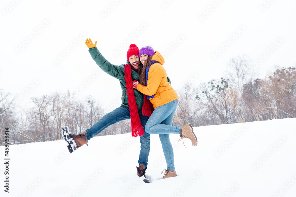 Full length photo of young lovely couple happy positive smile hug cuddle winter frost weather snow outside