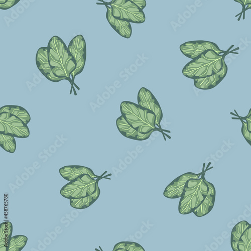 Seamless pattern bunch spinach salad on blue background. Simple ornament with lettuce.
