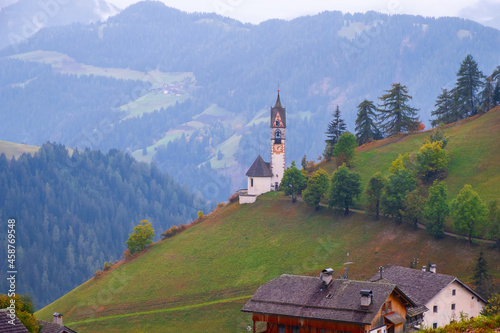 Church of Santa Barbara in the cozy little village of La Valle on a foggy morning, Alta Badia, South Tyrol © rolandbarat