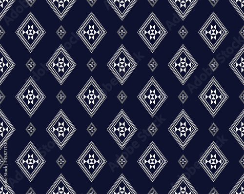 Seamless Geometric ethnic texture embroidery design on dark Blue background used in wallpaper,clothing,Batik,fabric, white triangle shapes Vector, illustration Design.eps
