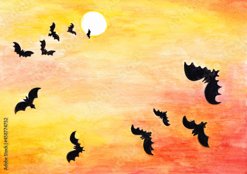 Halloween, bats on the background of the moon and red-yellow sky