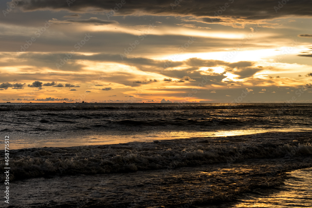 Dramatic golden sunset hour over the sea Dramatic golden sunset hour over the sea