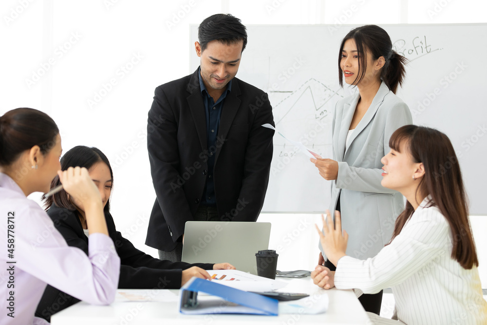 businesspeople team meeting or seminar, and presentation about work project from laptop computer in meeting room businesspeople team meeting or seminar, and presentation about work project from laptop computer in meeting room