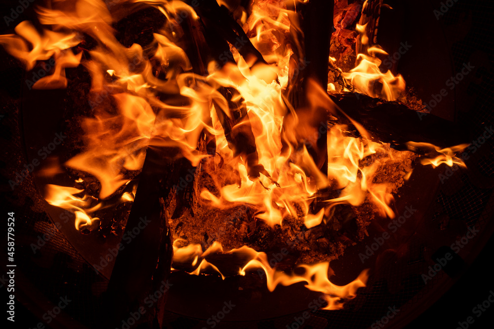 Close up shots of a wood fire in an outdoor fire pit. Close up shots of a wood fire in an outdoor fire pit.