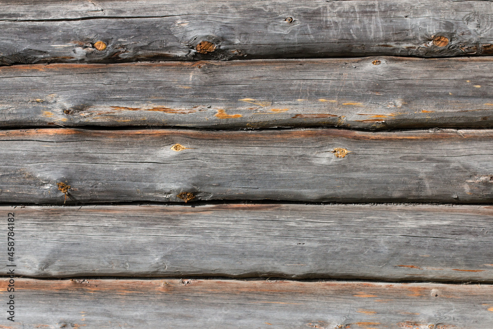 Log cabin or shed unpainted debarked wall textured. Horizontal background. Log cabin or shed unpainted debarked wall textured. Horizontal background.
