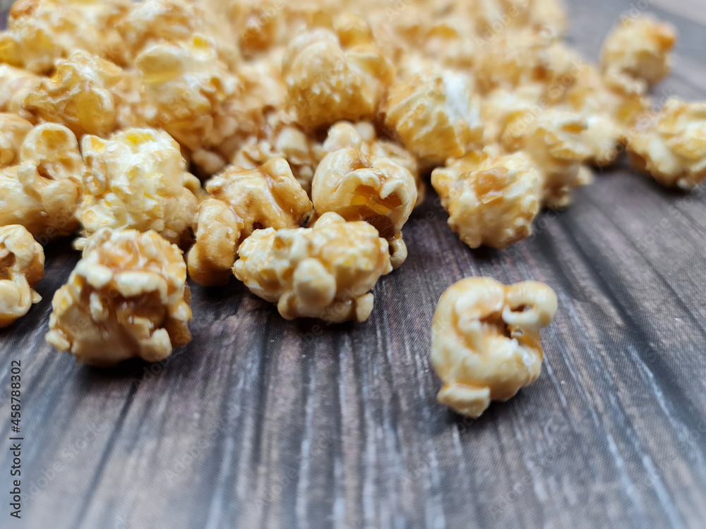 The Fresh hot natural popcorn close-up. Fresh caramel corn. The Fresh hot natural popcorn close-up. Fresh caramel corn.