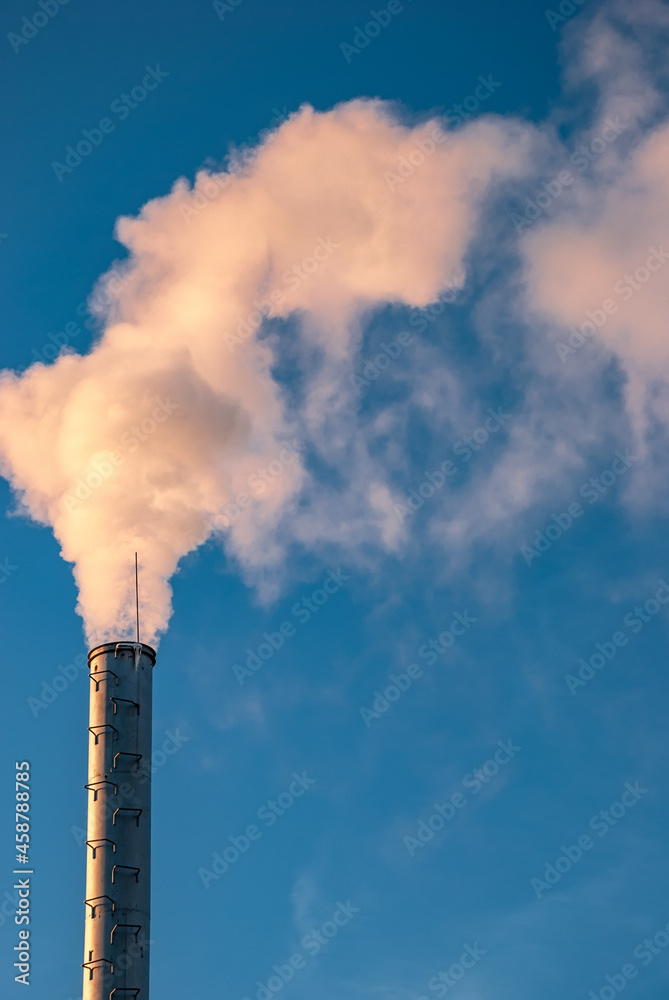 Industrial smoke from chimney on blue sky Industrial smoke from chimney on blue sky
