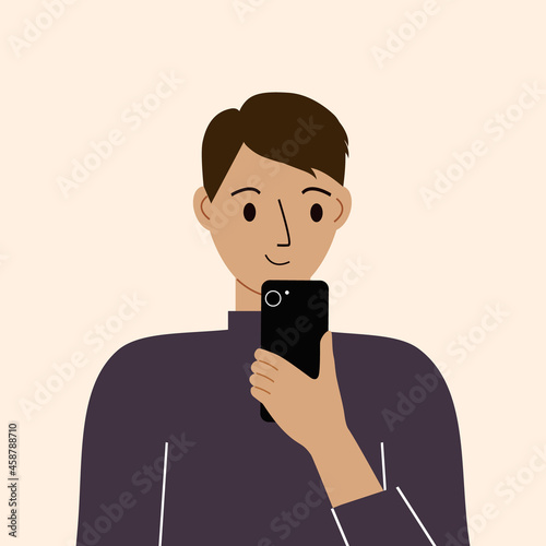 Joyful man with mobile phone, front view. Taking pictures, reading, chatting. Smartphone and internet addiction.