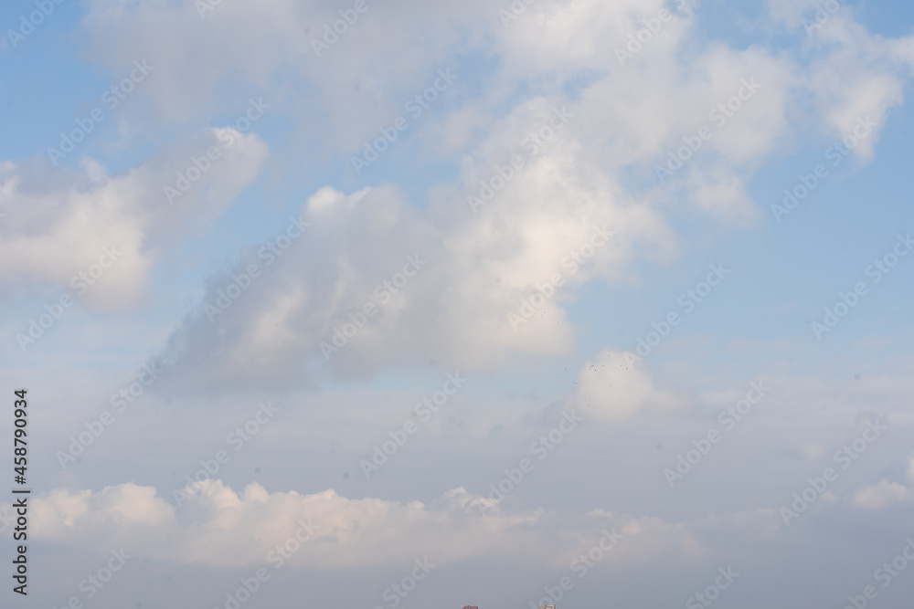 Sunny sky abstract background, beautiful cloudscape, on the heaven, view over white fluffy clouds, freedom concept