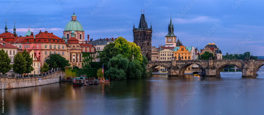 Famous Charles bridge in Prague during twilight.  