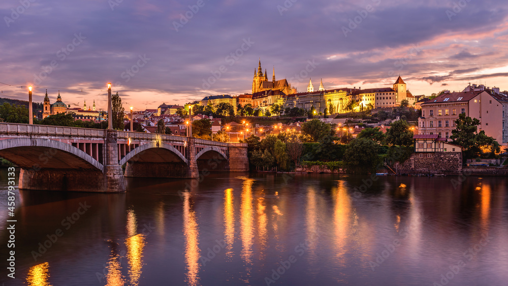 Cityscape of Prague with the famous castle during sunset.