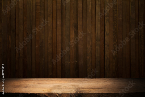 Empty dark wooden table in front of abstract blurred bokeh background of restaurant . can be used for display or montage your products.Mock up for space © kishivan