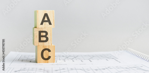 the word ABC structured query language, lined with wooden blocks.