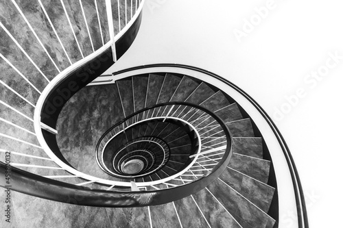 Sprial staircase forming a beautiful shell pattern with white wall for copy space photo