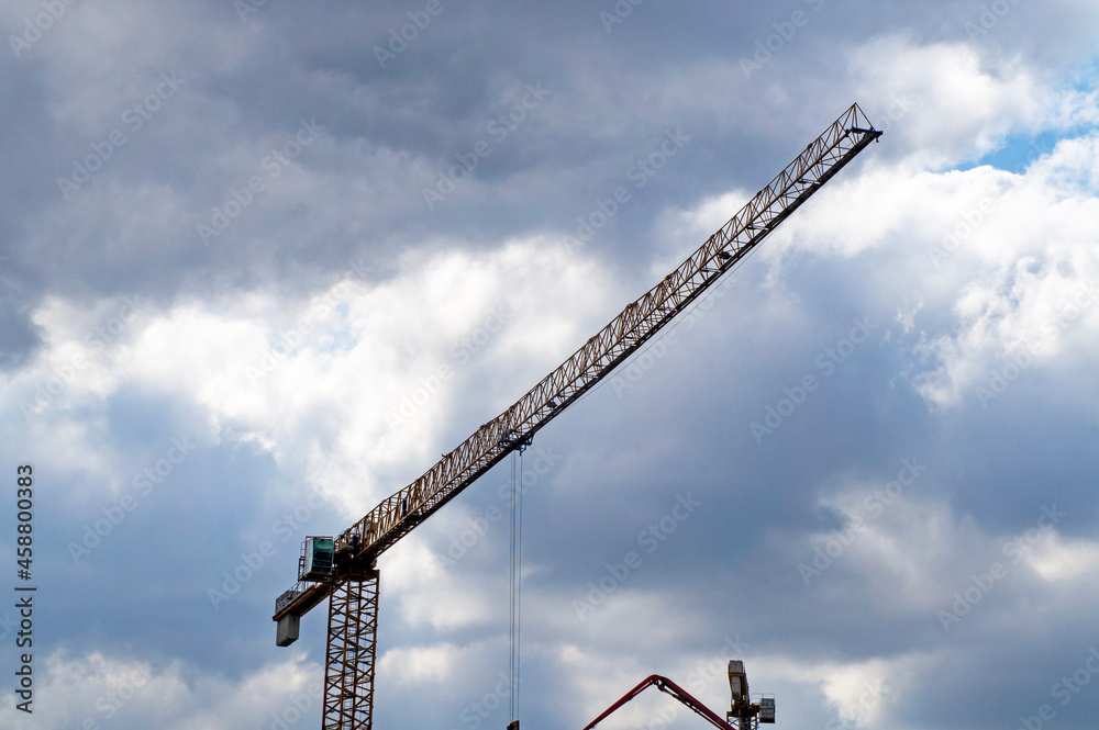 Construction tower crane on blue sky background Construction tower crane on blue sky background