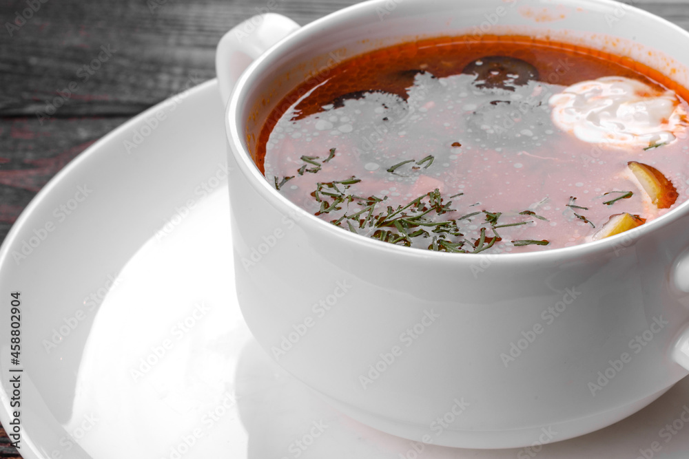 Appetizing dish of russian hodgepodge soup in ceramic pot Appetizing dish of russian hodgepodge soup in ceramic pot