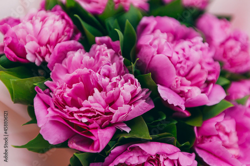 background texture with a bouquet of pink peonies