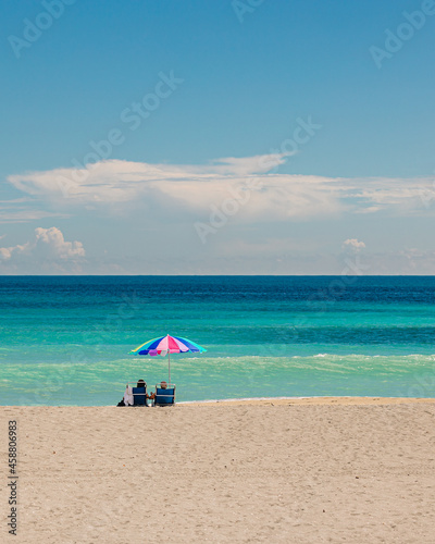 Gorgeous beach day with beach chairs and umbrella © Kevin