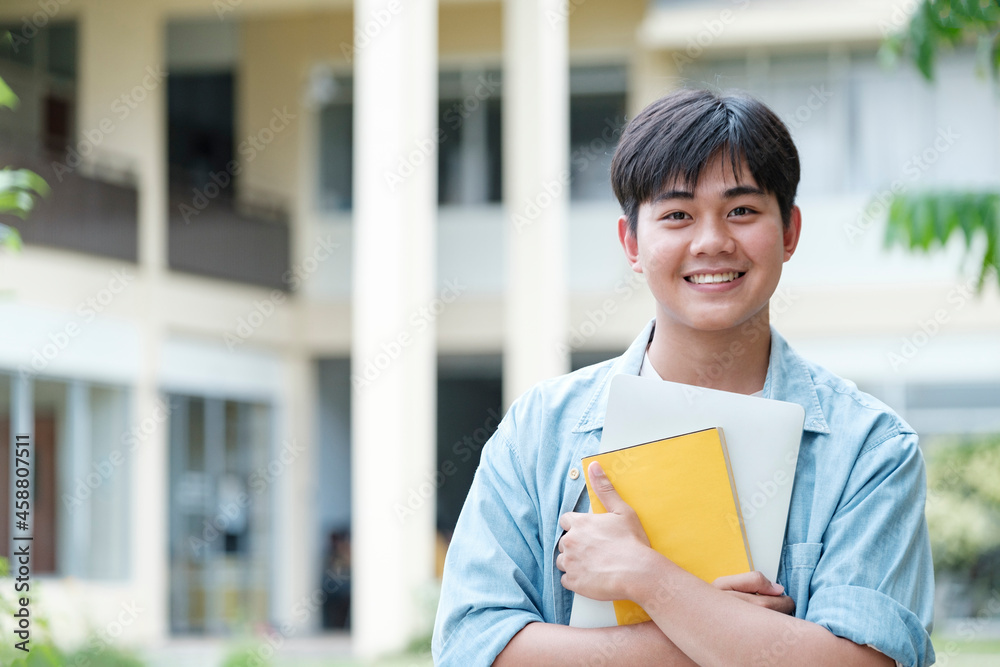 Young male student at university campus. 
