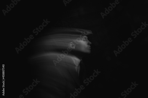 blurred portrait of a man in the dark
