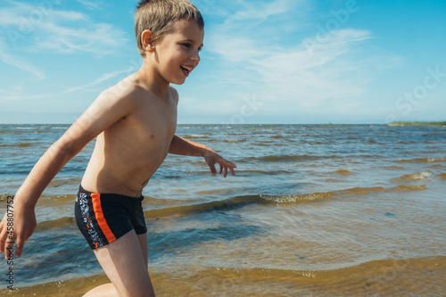 Children playing on the lake. Concept of friendly family.