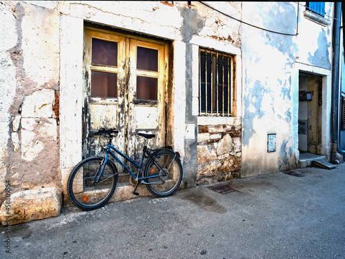 bicycle near a shabby wall