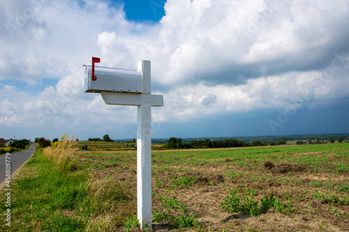 US mailbox in the countryside with sky background