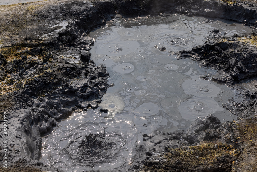 Kamchatka mud geyser in the valley of geysers. Fumaroles of the volcano.