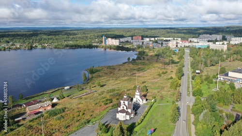 Aerial view of the city. Town. Houses. Lake. Clouds. City of Kondopoga drone shooting. photo