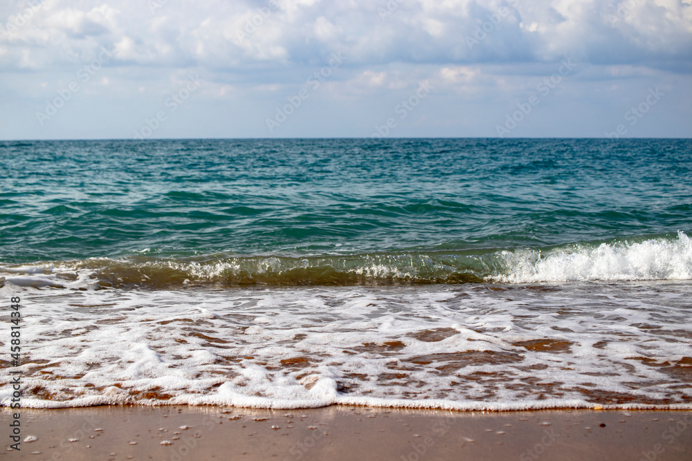 view from the beach, there are waves in the sea. view from the beach, there are waves in the sea.