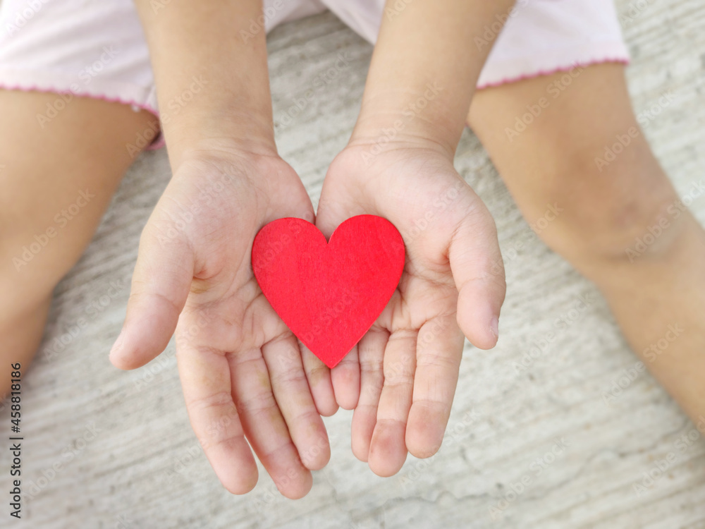 Red heart shaped on palms of hands background. Stock photo. Red heart shaped on palms of hands background. Stock photo.