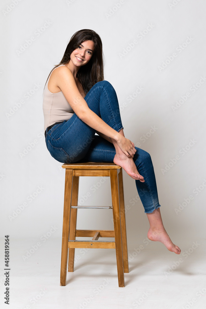 Teenager Brazilian girl over isolated background Teenager Brazilian girl over isolated background