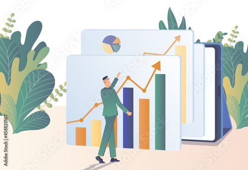 Profit growth. The businessman studies the graphs of profit growth.