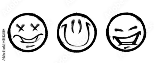 Three graffiti emoticons. Smiling face painted spray paint. Vector illustration on white background