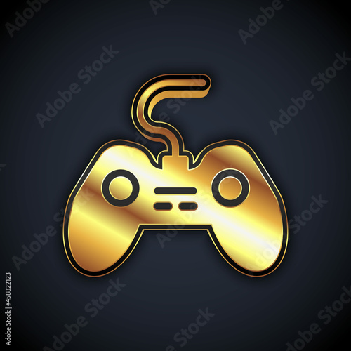 Gold Gamepad icon isolated on black background. Game controller. Vector