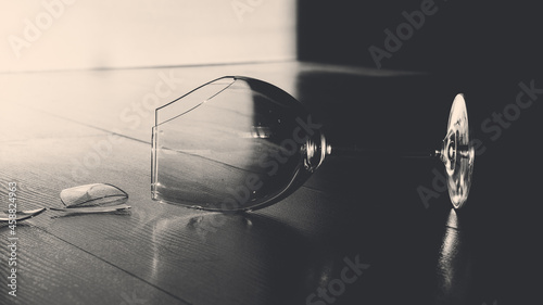 the broken wine glass in dark becground