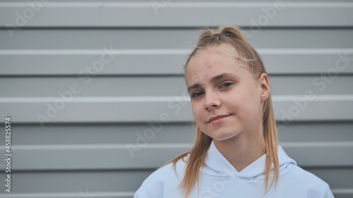 Portrait of a blonde teenage girl. Face close-up.