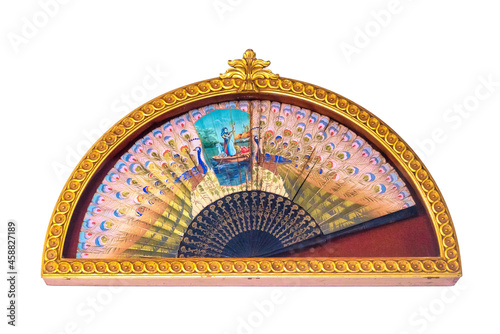 Decorative antique fan on a wall